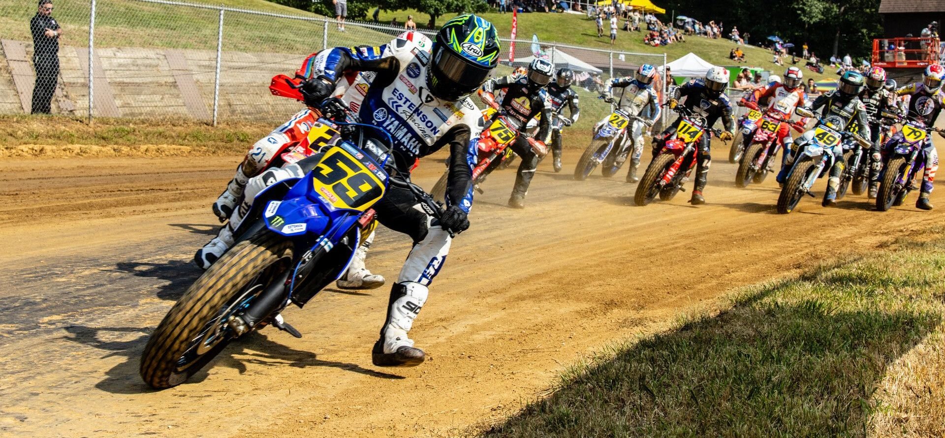 Tom Drane (59) leads the field into turn one during the AFT Singles presented by KICKER Main Event in Peoria. Photo by Tim Lester / courtesy American Flat Track.