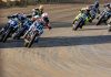 Mission AFT SuperTwins riders Trent Lowe (48), Briar Bauman (3), Dallas Daniels (32), Declan Bender (70), Brandon Price (92) and others round turn four during Race Three Saturday at the Springfield Mile. Photo by Tim Lester / courtesy American Flat Track.
