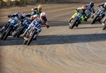 Mission AFT SuperTwins riders Trent Lowe (48), Briar Bauman (3), Dallas Daniels (32), Declan Bender (70), Brandon Price (92) and others round turn four during Race Three Saturday at the Springfield Mile. Photo by Tim Lester / courtesy American Flat Track.