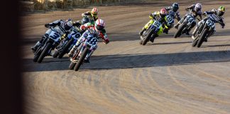 Mission AFT SuperTwins riders Trent Lowe (48), Briar Bauman (3), Dallas Daniels (32), Declan Bender (70), Brandon Price (92) and others round turn four during Race Three Saturday at the Springfield Mile. Photo by Tim Lester / courtesy American Flat Track.