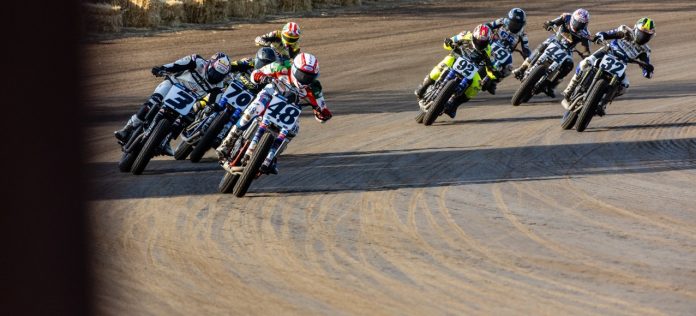 Mission AFT SuperTwins riders Trent Lowe (48), Briar Bauman (3), Dallas Daniels (32), Declan Bender (70), Brandon Price (92) and others round turn four during Race Three Saturday at the Springfield Mile. Photo by Tim Lester / courtesy American Flat Track.
