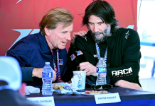 V10 Entertainment, the producer of the docuseries featuring Keanu Reeves’ ARCH Racing team, has secured global distribution rights to MotoAmerica’s live racing. MotoAmerica President Wayne Rainey is pictured in discussion with Reeves. Photo courtesy MotoAmerica.