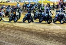 Mission AFT SuperTwins riders Briar Bauman (3), Dallas Daniels (32), Brandon Robinson (44) lead the rest of the pack during Round 10 in Sturgis Monday night. Photo by Tim Lester / courtesy American Flat Track.