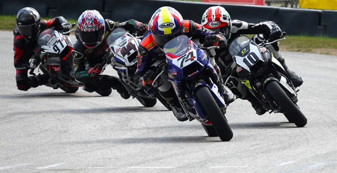 Kensei Matsudaira (74) made a dramatic last-lap pass on Mahdi Salem (10) to win the first GP190 race on Saturday. The two crashed together in race two, opening the way for Connor Raymond (44) to take the victory. Photo by Larry Lawrence