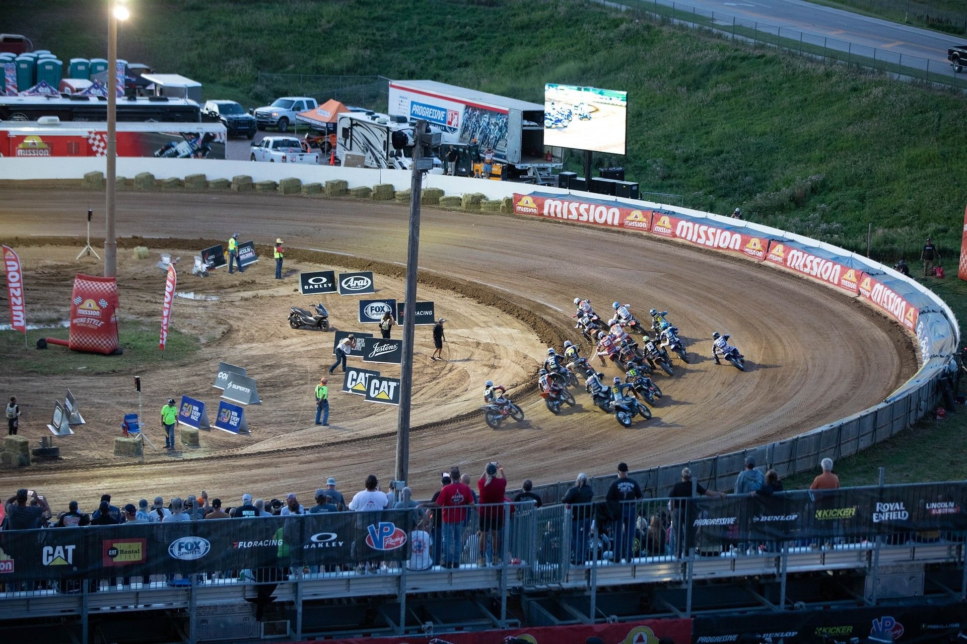 AFT Singles presented by KICKER riders take the first turn at the Jackpine Gypsies MC in Sturgis during Round 10 Photo by Scott Hunter / courtesy American Flat Track