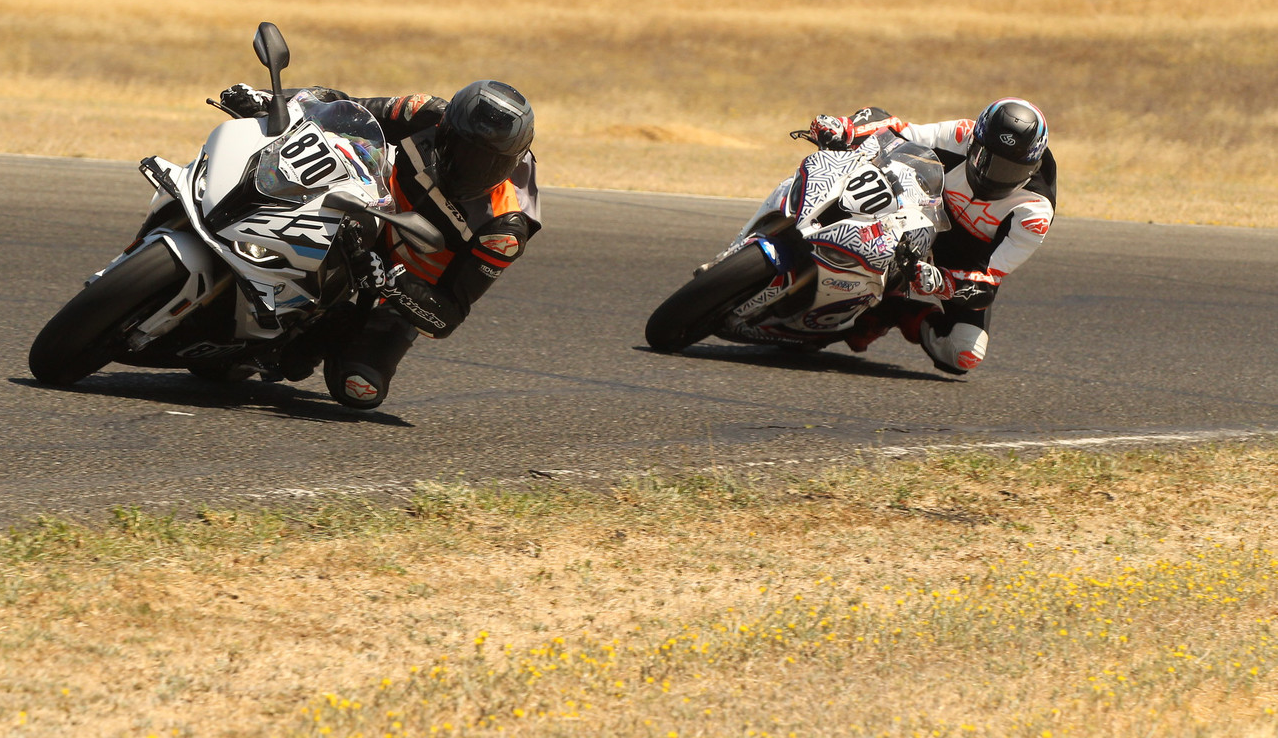 Stuman Chasing another rider. Both riders on BMW S 1000 RR motorcycles. Photo credit GotBlueMilk photography