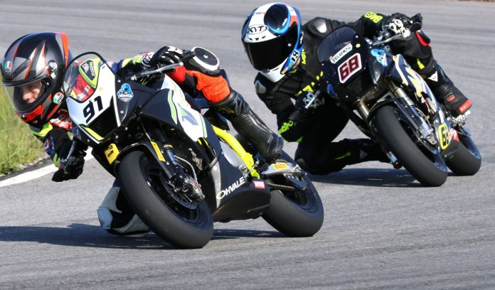 Early in the opening of three Motul MiniGP Canadian National races, Ethan Reardon leads Championship rival Jager Stockill – they would battle for first in each of the final events of the 2025 Canadian campagin, and will represent their country together in Spain this November. Photo courtesy Colin Fraser