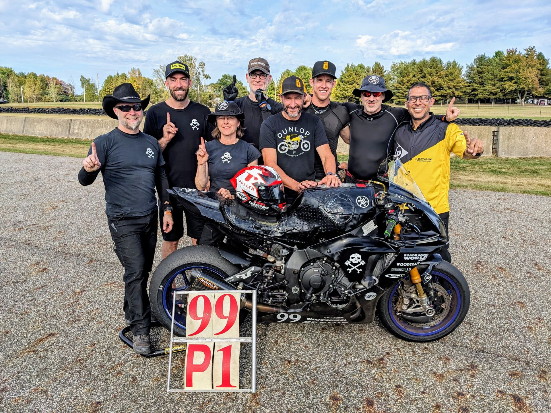 Reach for the sky! Or, at least, point to it. From left: YTLechner, Taylor Knapp, Melissa Berkoff, Chris Manfrin, Josh Hayes, Hunter Dunham, Sam Fleming, Tony Romo. Photo courtesy AOD.