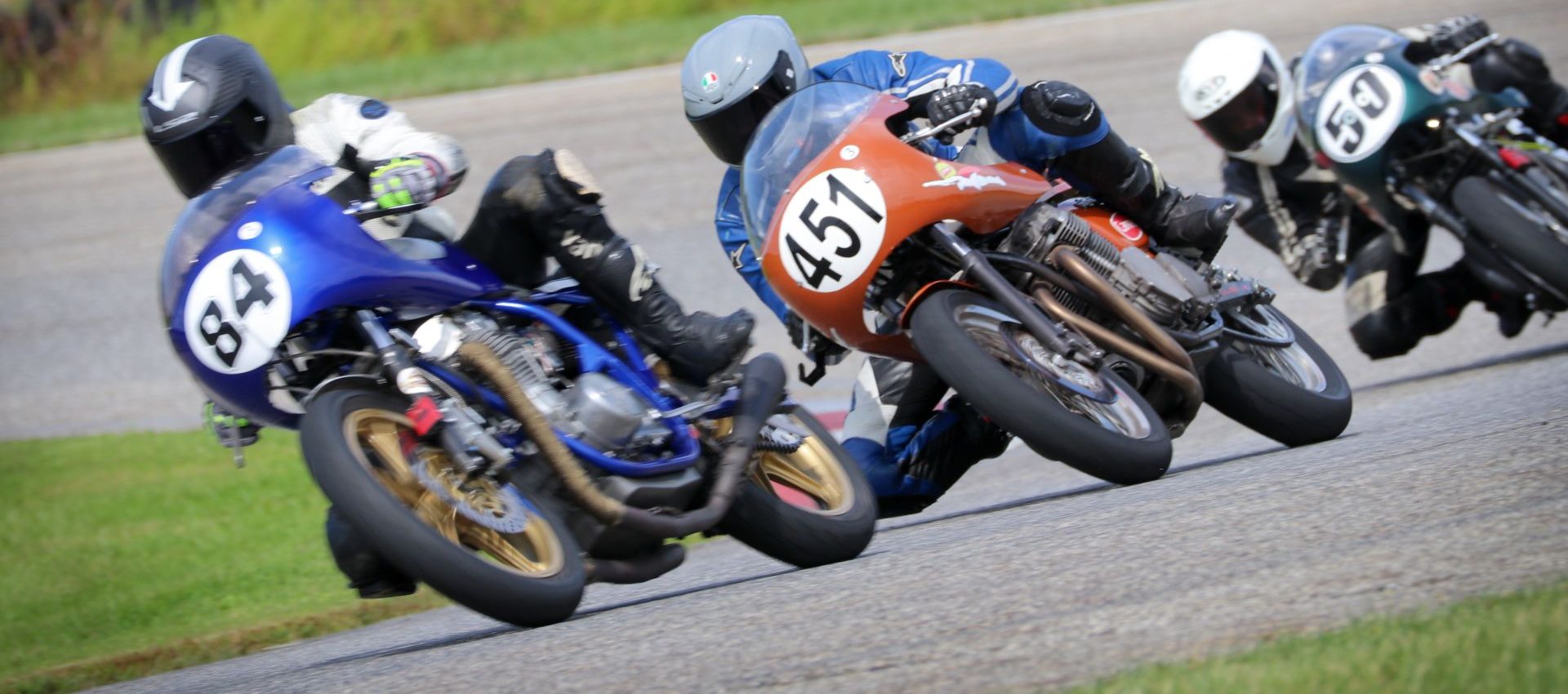 Jeff Hargis (84), Brady Ingelse (451), and Tony Read (50) battle at Nelson Ledges in AHRMA’s Formula 750 race. Photo Credit Craig Chawla.
