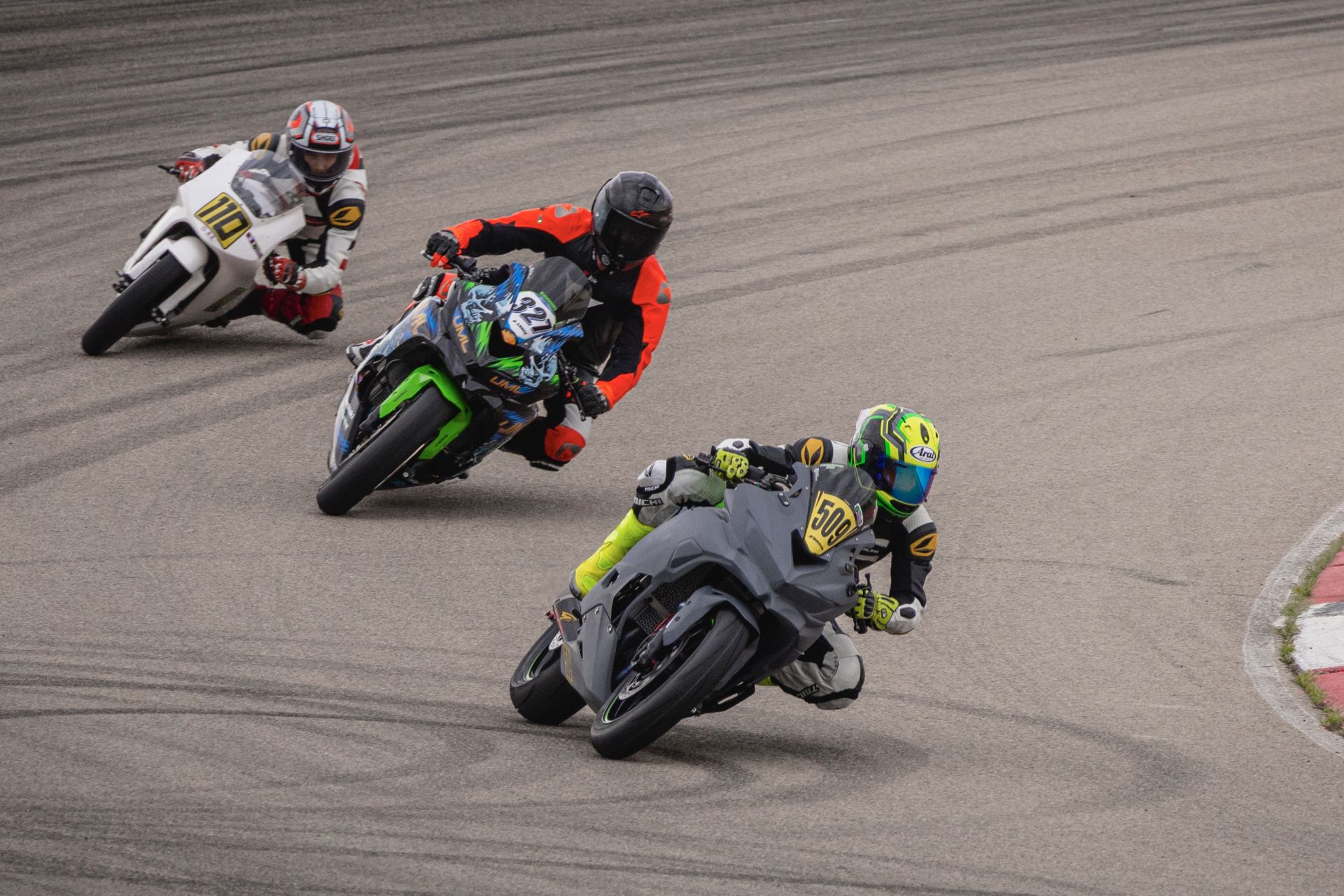 Martina Velcheva (509) leading Dustin Lance (327) and Sean Groenstein (110) in lightweight sbk race. Photo by Crystall Doll.
