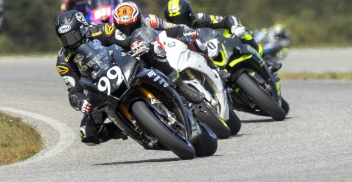 Josh Hayes on the AOD bike leads teams Real Beal Racing and Endless Motorsports early in the race before ripping open an insurmountable gap. Photo by Turn 13 Photo.