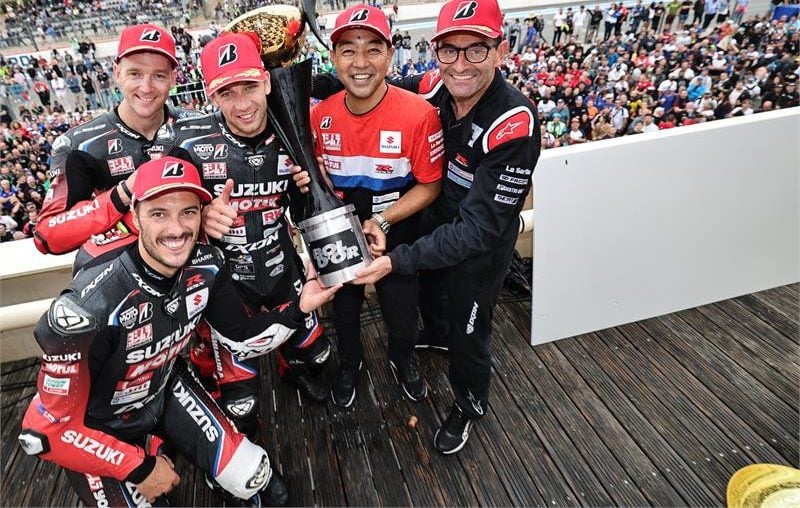 The team celebrates on balcony [l-r] Etienne Masson, Dan Linfoot, Gregg Black, Yohei Kato, Damien Saulnier. Photo courtesy SERT Team.