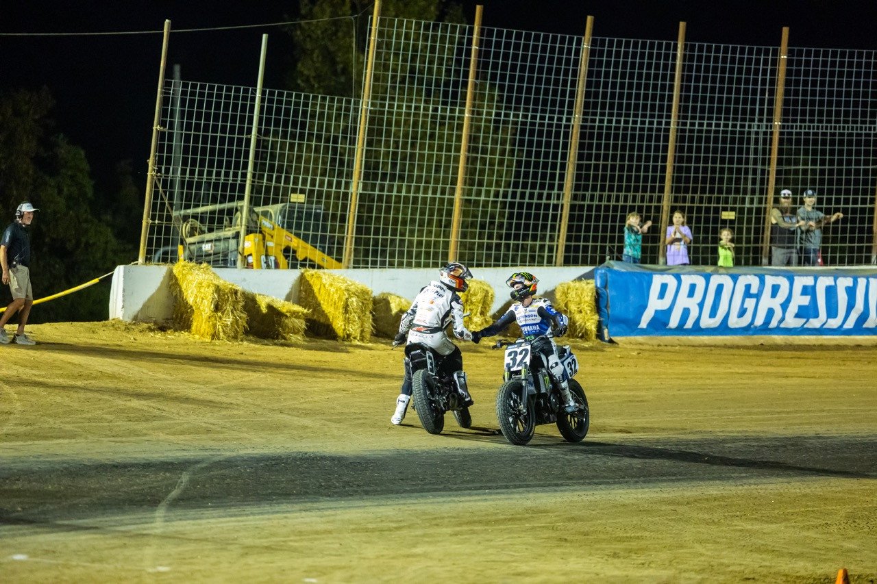 Briar Bauman (3) and Dallas Daniels (32) congratulate each other immediately following the Mission AFT SuperTwins Main Event Saturday night. [Photo: American Flat Track / Tim Lester]
