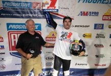 Dallas Daniels (32) celebrates after receiving his Championship #1 plate from Mike Burkeen (American Motorcyclist Association) at Lake Ozark Speedway Saturday night. Photo by Tim Lester / courtesy American Flat Track.