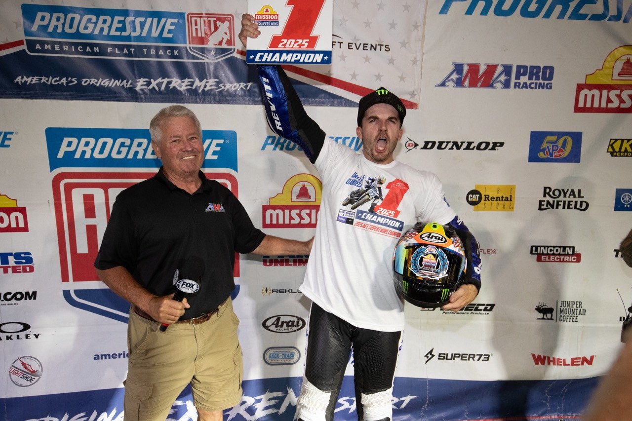 Dallas Daniels (32) celebrates after receiving his Championship #1 plate from Mike Burkeen (American Motorcyclist Association) at Lake Ozark Speedway Saturday night. Photo by Tim Lester / courtesy American Flat Track.