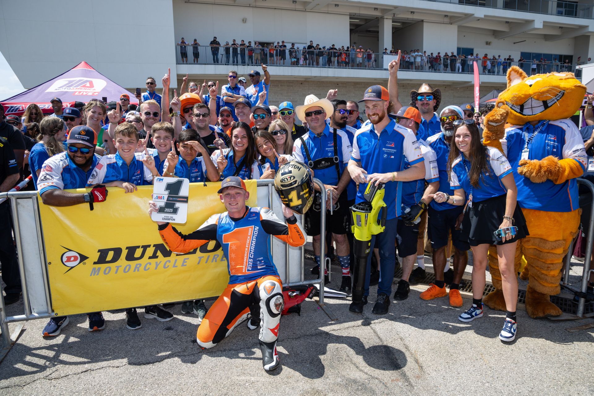 Lee with his ever-enthusiastic OrangeCat Racing team. Photo by Brian J. Nelson.