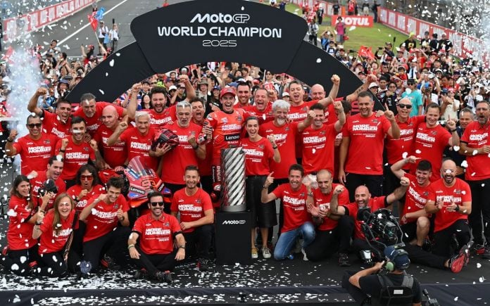 Marc Márquez marks his return to the top of MotoGP by clinching the 2025 World Championship, celebrating with his Ducati team. Photo courtesy Dorna.