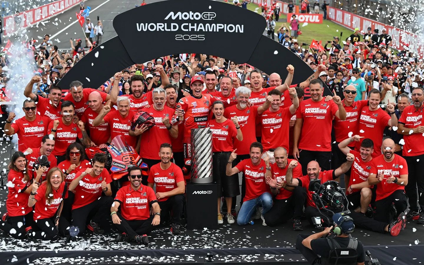 Marc Márquez marks his return to the top of MotoGP by clinching the 2025 World Championship, celebrating with his Ducati team. Photo courtesy Dorna.