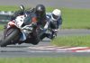 A Coach Working On Track With a Professional Rider image
